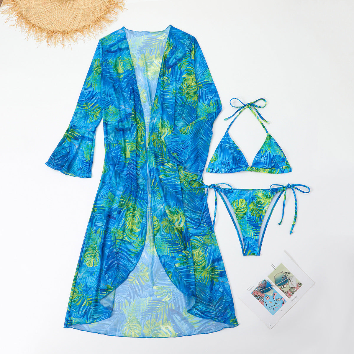 Blue and green floral swimsuit with matching robe on a white background