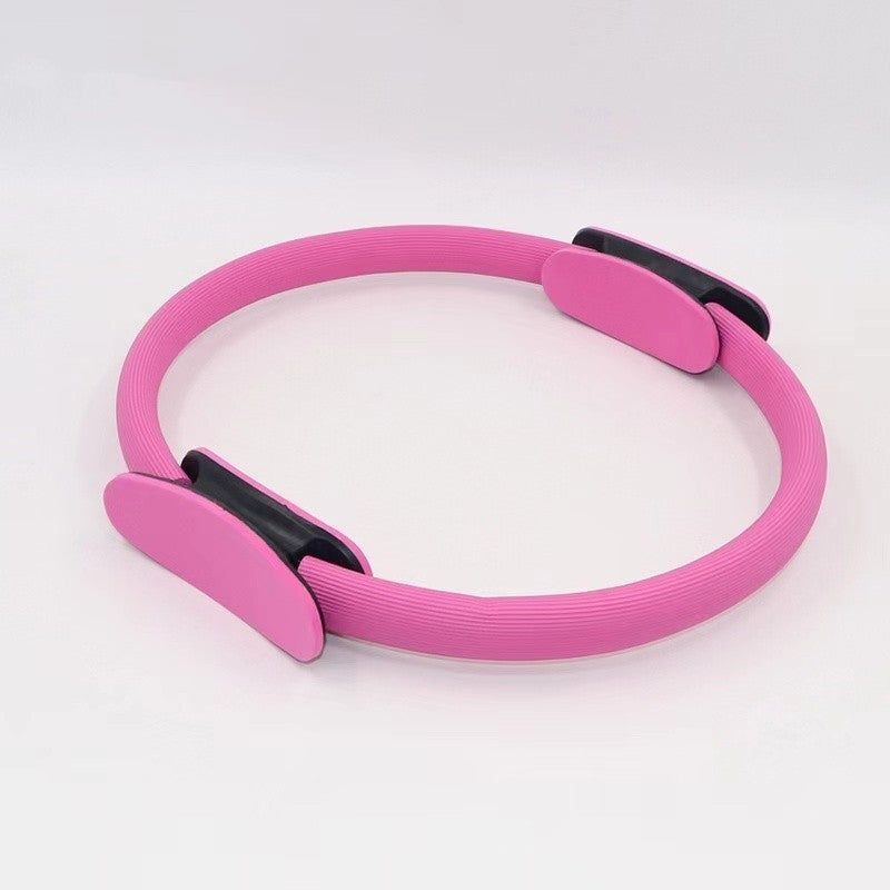 A person demonstrating the use of a purple Yoga Pilates Magic Circle, which is a fitness and toning tool for exercises targeting areas like thighs, abs, and neck.