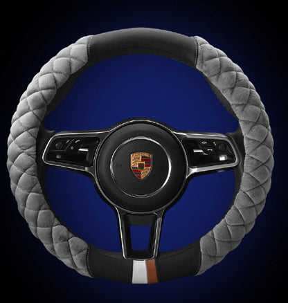 Steering wheel with gray quilted cover and blue background