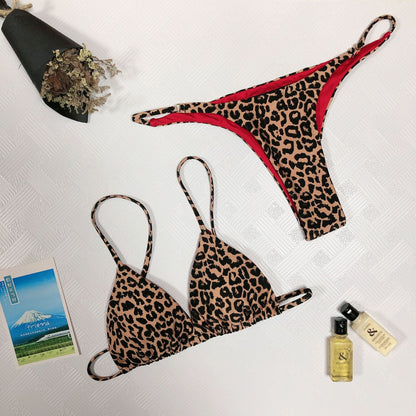 Leopard print bikini set on a white background with accessories.