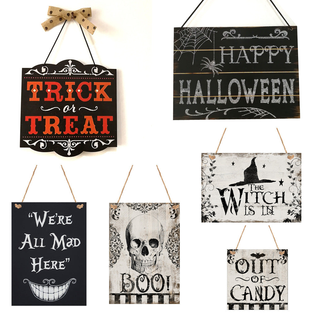 A set of Halloween-themed wooden hanging boards with various festive designs including 'Trick or Treat', 'Happy Halloween', and others with skulls and ghosts.