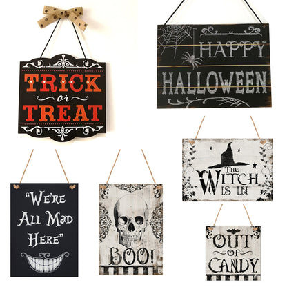 A set of Halloween-themed wooden hanging boards with various festive designs including 'Trick or Treat', 'Happy Halloween', and others with skulls and ghosts.