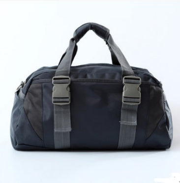 A pink and gray nylon yoga bag with a shoulder strap and a silhouette of a yoga pose on the front.