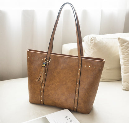 Women's Studded Tote Shoulder Bag – Vegan-Friendly Imitation Leather Tassel Handbag