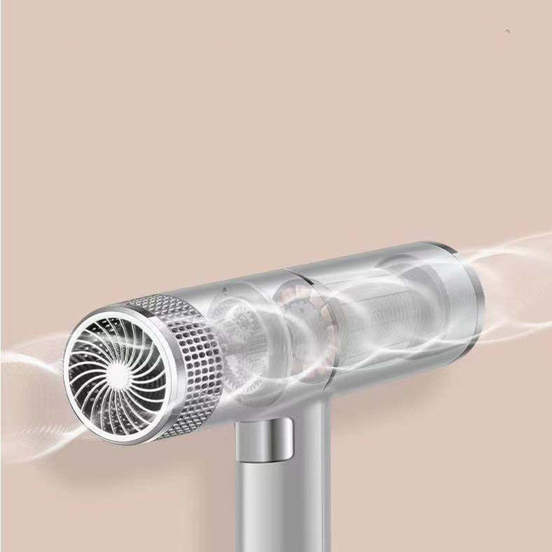 Silver vacuum cleaner head with airflow on a neutral background
