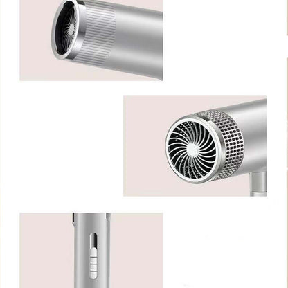 Close-up of a metallic hair dryer nozzle and handle on a light background.