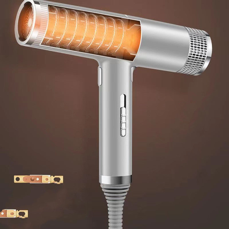 Silver hair dryer with orange interior on a brown background