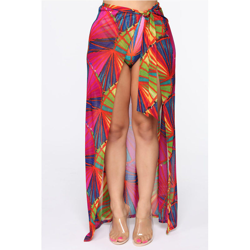 Colorful patterned skirt worn by a model on a white background.