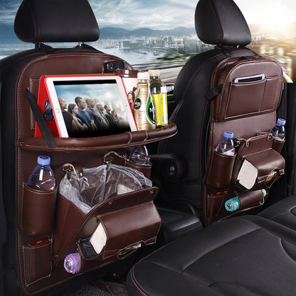 A multifunctional car storage hanging bag attached to the back of a car seat, featuring pockets with various items such as bottles and a tablet, and a built-in trash can.
