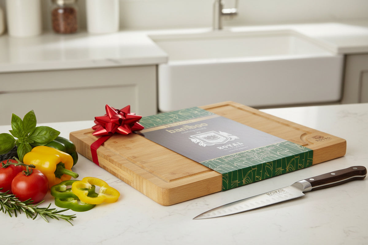 A rectangular bamboo cutting board with a green and brown color scheme, featuring a grooved edge and a brand logo in the center.
