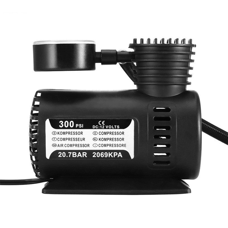A portable mini air compressor with a black color, displaying specifications like 300 PSI, 20.7 Bar, and 2669 KPA on its label.