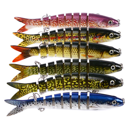 A collection of artificial multi-jointed fishing lures in various colors designed for pike and carp fishing.