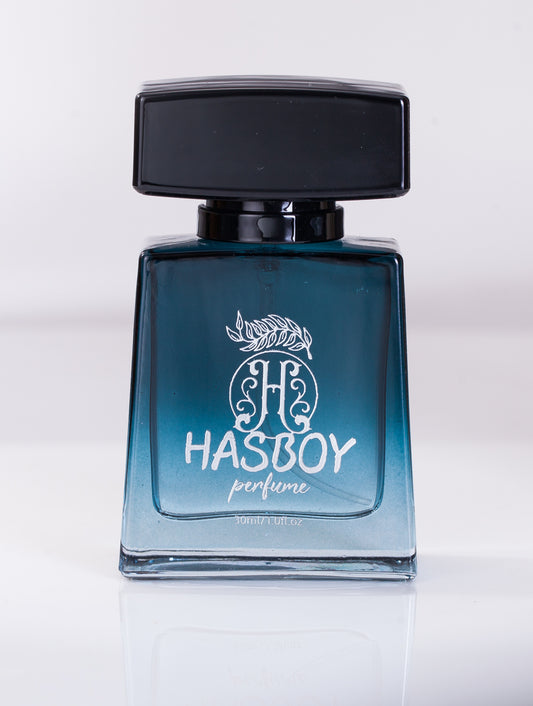 A bottle of Vibrant Men's Eau De Toilette Cologne with a blue label and black cap, displaying the brand name and fragrance type.