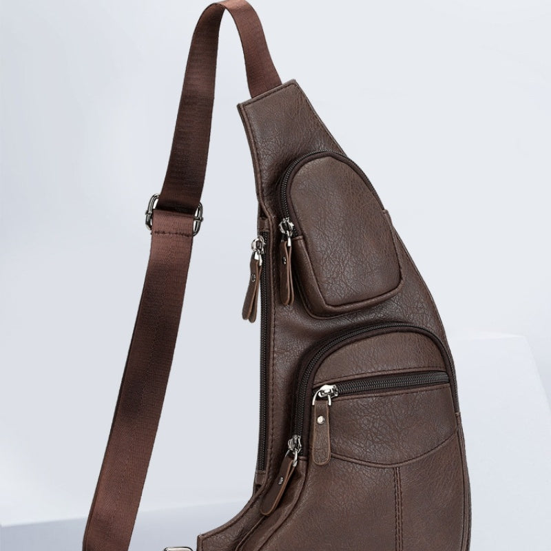 A brown faux leather men's casual chest bag with multiple compartments and an adjustable shoulder strap.