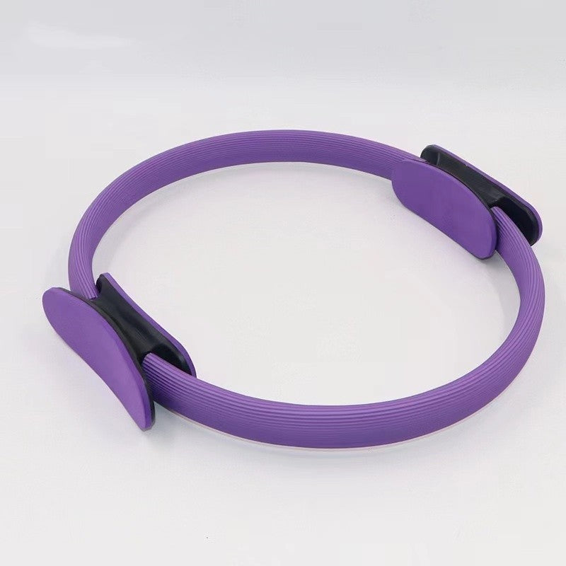 A person demonstrating the use of a purple Yoga Pilates Magic Circle, which is a fitness and toning tool for exercises targeting areas like thighs, abs, and neck.