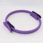 A person demonstrating the use of a purple Yoga Pilates Magic Circle, which is a fitness and toning tool for exercises targeting areas like thighs, abs, and neck.