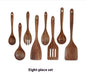 Wooden kitchen utensil set with eight pieces on a white background.