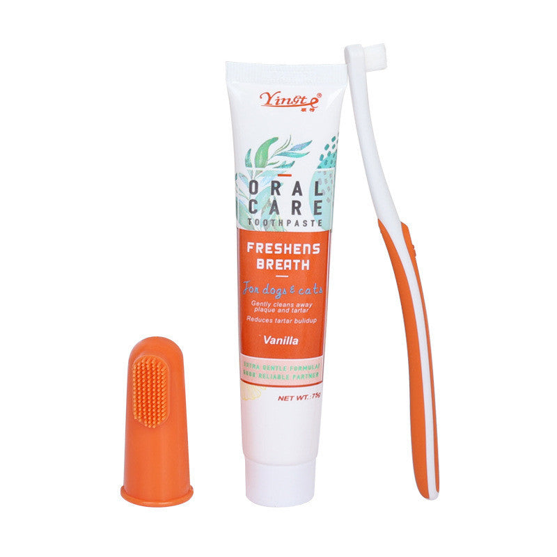 Dog toothbrush and toothpaste set on a white background