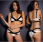 The image features a striking bikini swimwear piece, predominantly in shades of red and black. The top is designed with a bold, minimalist aesthetic, consisting of a few sleek straps that provide a halter neck effect and a low-cut back, accentuating the vibrant red bikini bottoms.