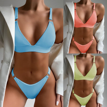 This image displays a collection of two-piece solid color swimsuits in various vibrant hues. The swimsuits feature a minimalist design with smooth, solid colors and are showcased in blue, pink, and green.