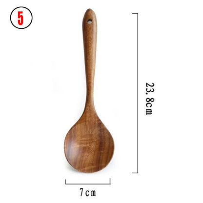 A set of wooden kitchen utensils including a ladle, spoon, turner, and colander, displayed in a clear container on a kitchen counter.