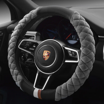 Steering wheel with gray cover in a car interior