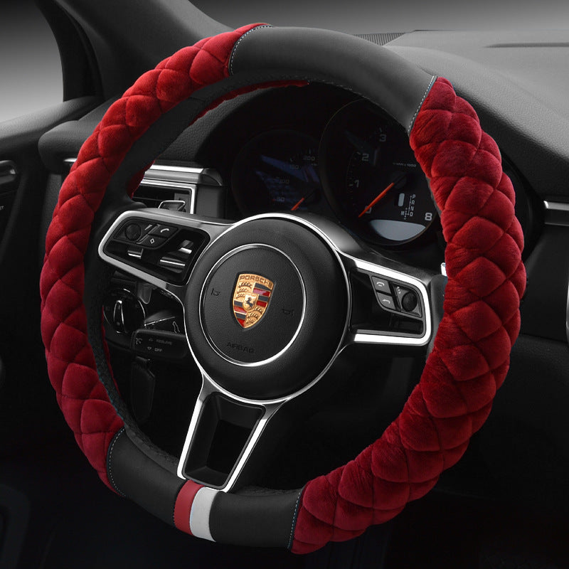 A red plush steering wheel cover with a black interior ring, designed for a vehicle's steering wheel.