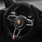 A red plush steering wheel cover with a black interior ring, designed for a vehicle's steering wheel.
