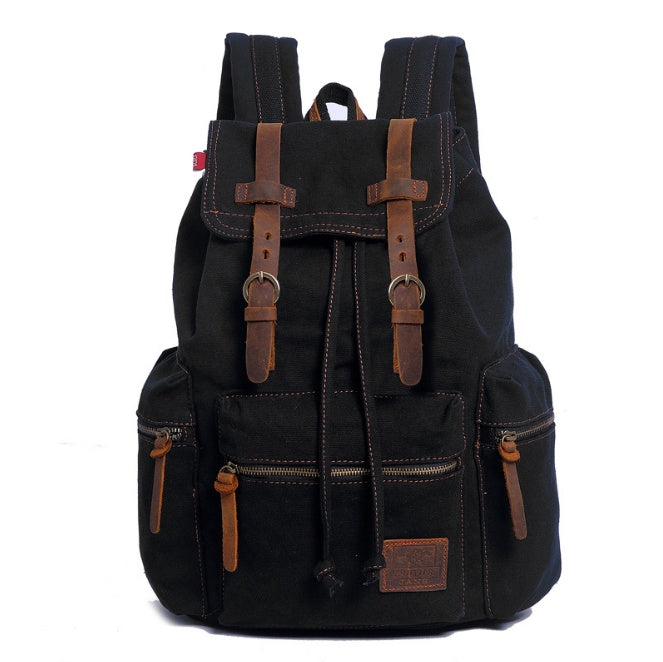 Black backpack with brown straps and accents on a white background
