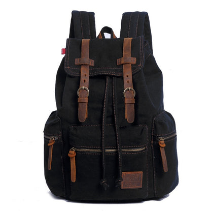 Black backpack with brown straps and accents on a white background