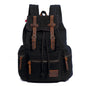 Black backpack with brown straps and accents on a white background