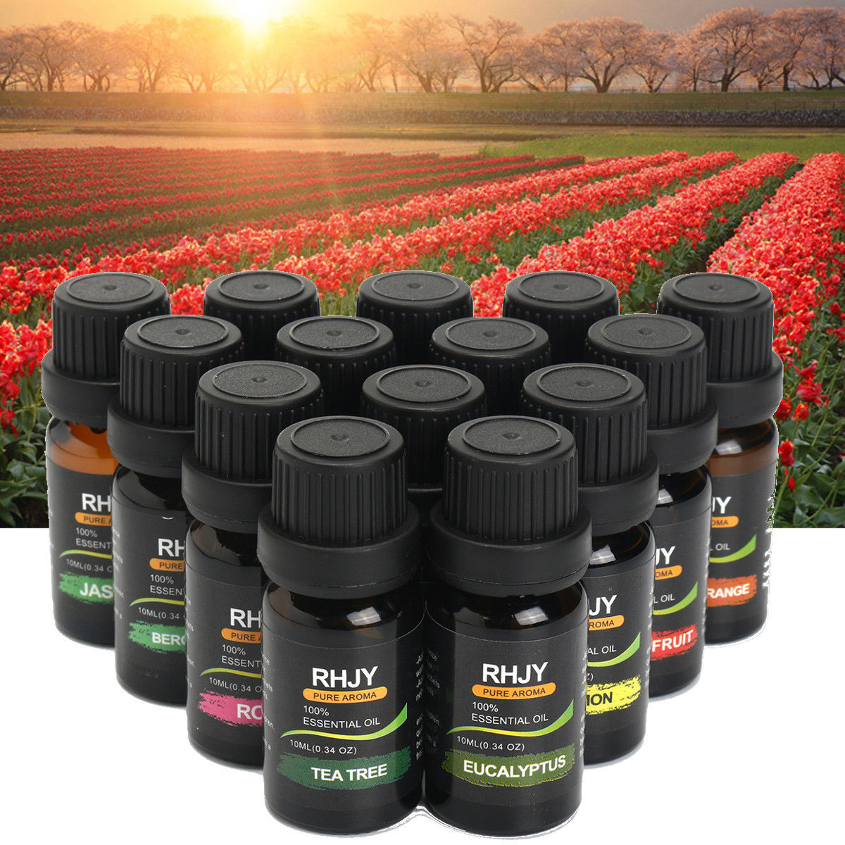 Bottles of essential oils with a tulip field in the background.