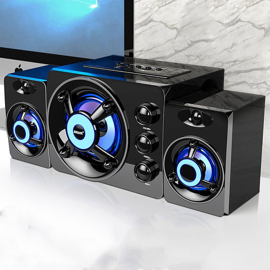 A set of desktop home speakers with colorful blue lights, featuring a central speaker with two smaller speakers on the sides, control knobs, and a USB connection cable.