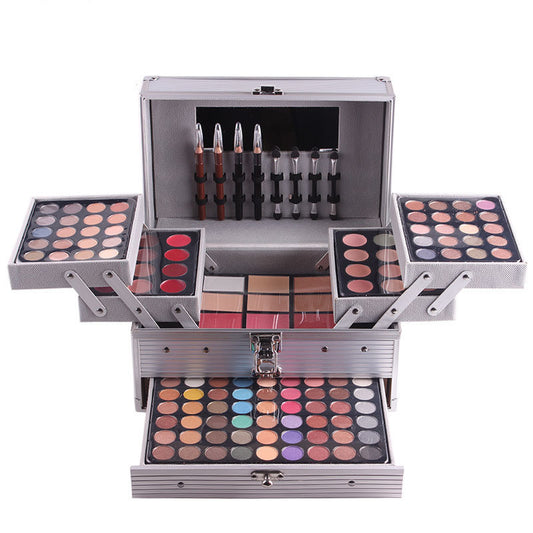 A comprehensive makeup kit with various colors of eye shadow, concealer, lipstick, and other makeup tools, organized in a portable case.