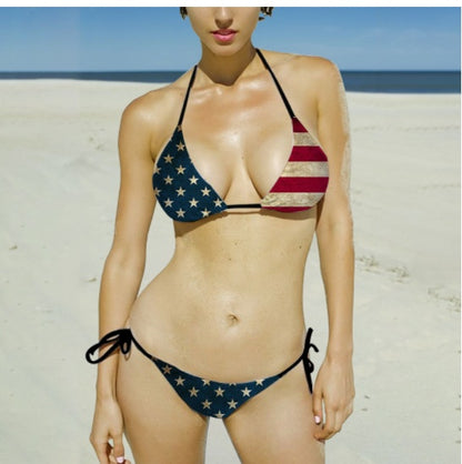 A young woman at the beach wearing a stars and stripes patterned bikini, reminiscent of the American flag.