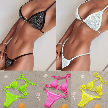 This image displays an assortment of female swimsuits, available in multiple colors including black, white, pink, yellow, and fluorescent green. Each bikini features a detailed, diamond-studded design that enhances its stylish appeal.