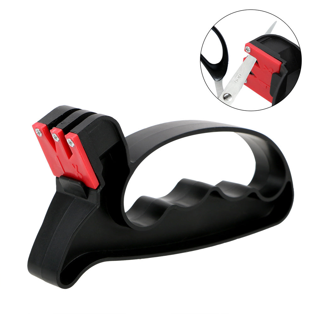 A handheld knife sharpener with a black body and red accents, designed for sharpening both knife and scissors.