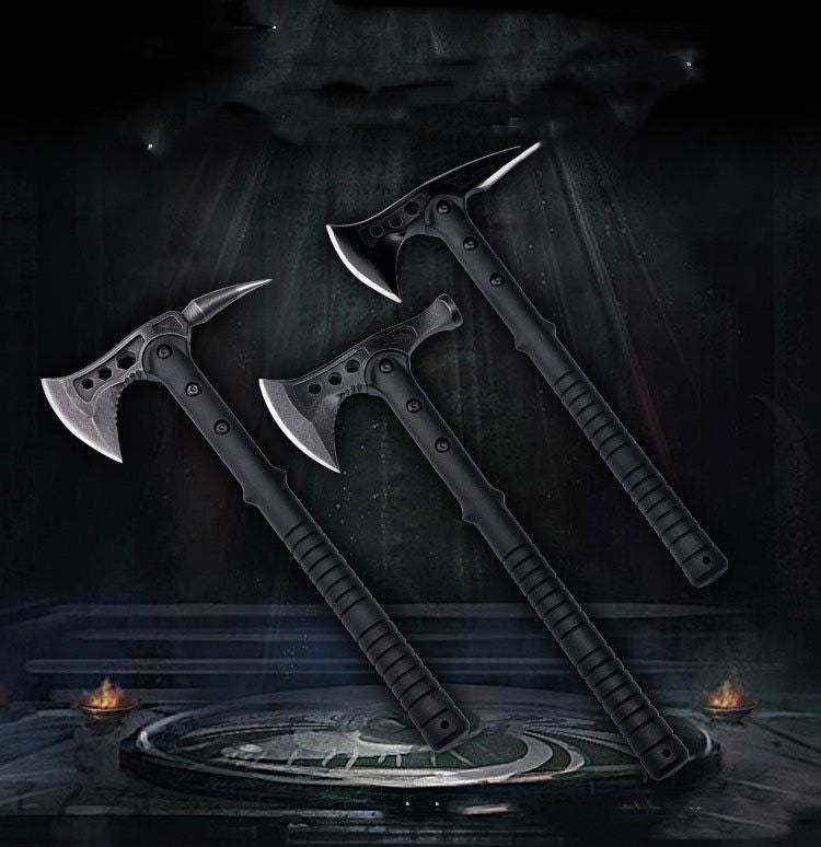 Two black multi-functional camping axes with different designs, one with a pointed tail and the other with a hammer head, displayed against a dark, moody background with a reflective surface.