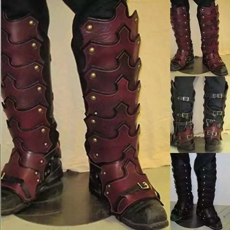 A set of European medieval court warrior leg guard props made from synthetic leather, displayed in black and red colors with buckles and studs.