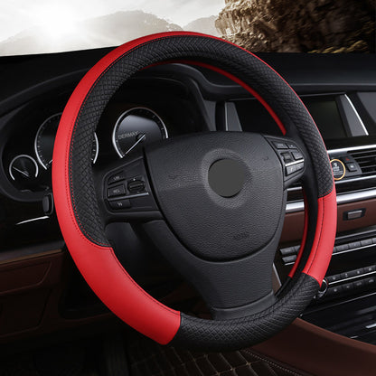 A red and black leather steering wheel cover installed on a car's steering wheel.