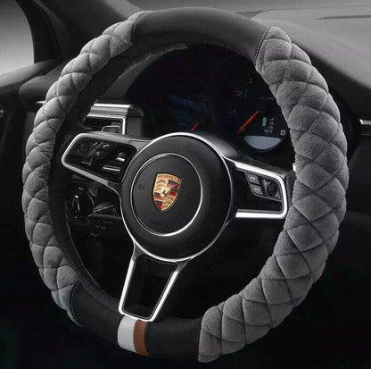 A red plush steering wheel cover with a black interior ring, designed for a vehicle's steering wheel.