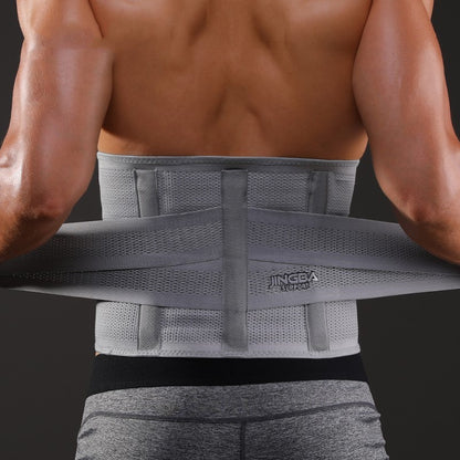Person wearing a gray back brace against a dark background