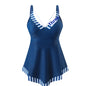 A model wearing a plus-size two-piece swimsuit in blue with white stripes, designed for swimming and wading.