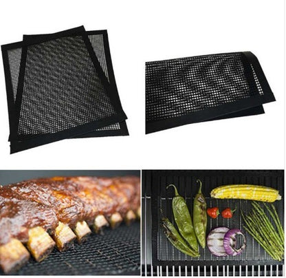 The image shows a pair of black Teflon mesh grill mats. One mat is displayed by itself, and the other is shown in use on a grill with vegetables and meat resting on top.