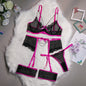 A woman modeling a pink lingerie set which includes a bra, panties, and garter straps.