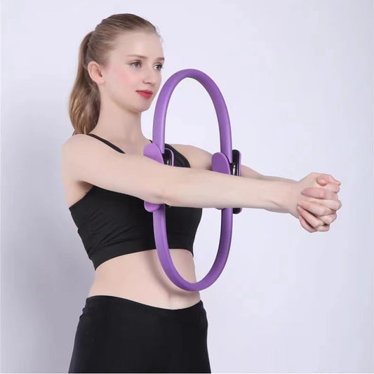 A person demonstrating the use of a purple Yoga Pilates Magic Circle, which is a fitness and toning tool for exercises targeting areas like thighs, abs, and neck.