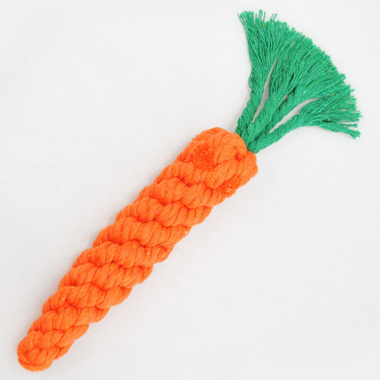 Orange rope toy shaped like a carrot with a green tuft on a white background
