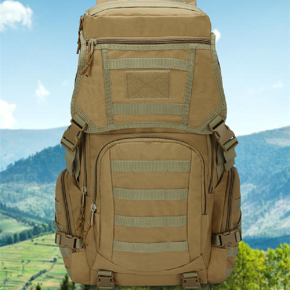 A multifunctional hiking bag in khaki color with camouflage pattern, featuring multiple compartments and external pouches, positioned against a scenic landscape.