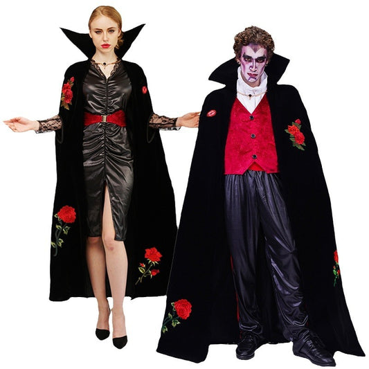 A couple wearing Halloween costumes, with rose embroidery details, one as a female character in black with red roses and the other as a male character in a red vest with black cape.