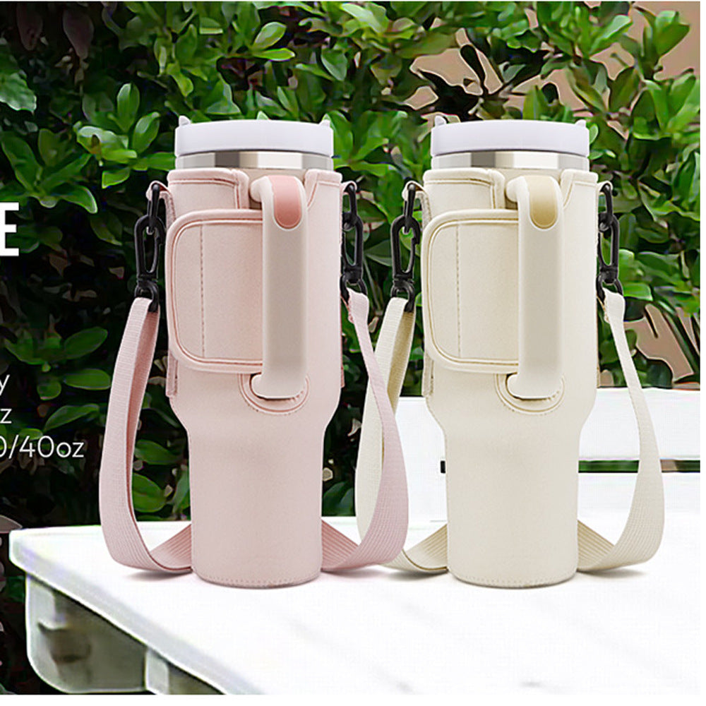 Two tumbler cases in pink and apricot colors with straps, displayed outdoors.